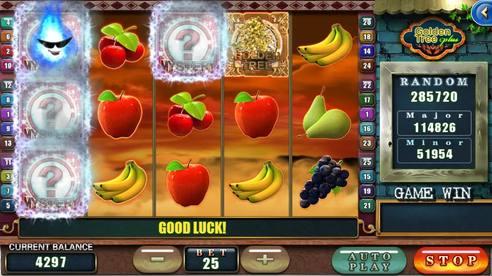 Golden Tree Plus reels during a spin with the first reel and one tile on the third reel covered by glowing MYSTERY question-mark tiles, a blue flame face in the corner and a STOP button